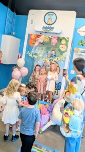 An upside down claw machine photo op